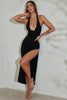 Vestido largo de modal con escote halter y abertura en el muslo en color negro.