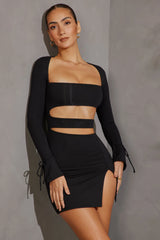 Enya Minivestido negro de manga larga con aberturas