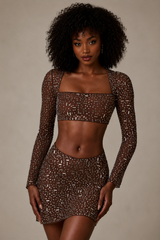 Tisiny- Minifalda transparente con cintura en V adornada en color cacao intenso.